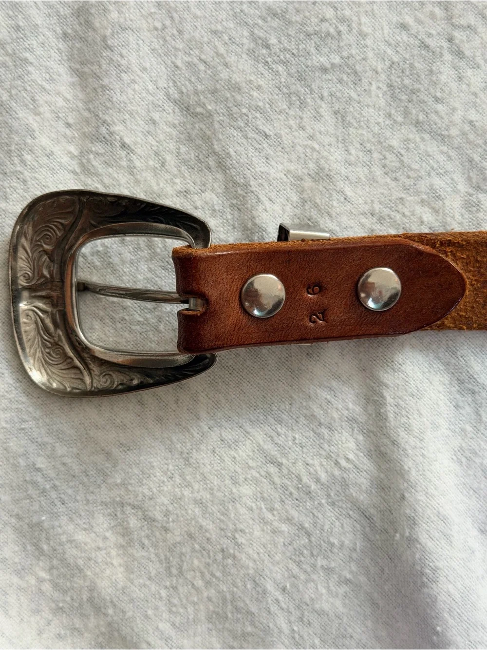 Vintage Western tooled leather belt with a three-piece engraved silver-tone 26